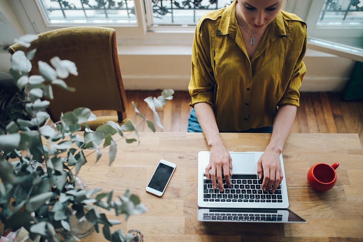 Young freelancer woman working in her apartment