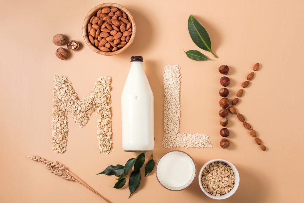 Oats, soy beans and almonds are used to spell out milk.